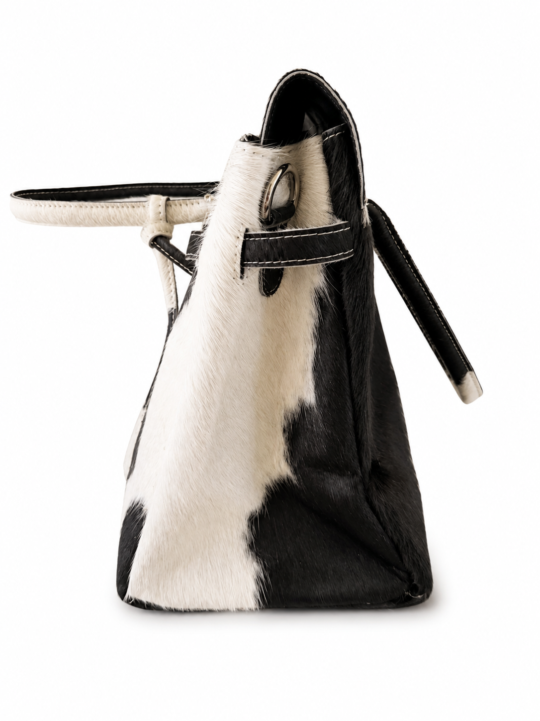 Side view of large black and ivory hair-on-hide handbag